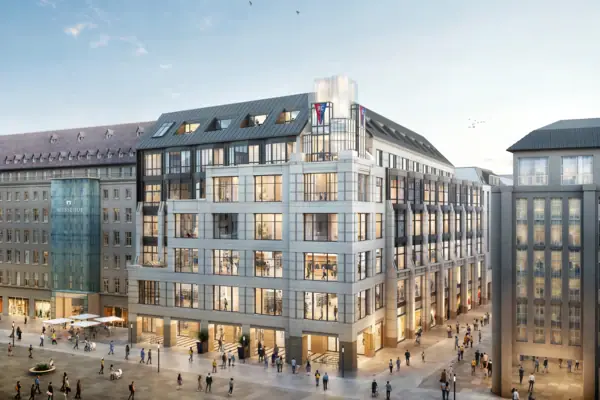Een groep mensen loopt rond het toekomstige HENRI Hotel in Leipzig.