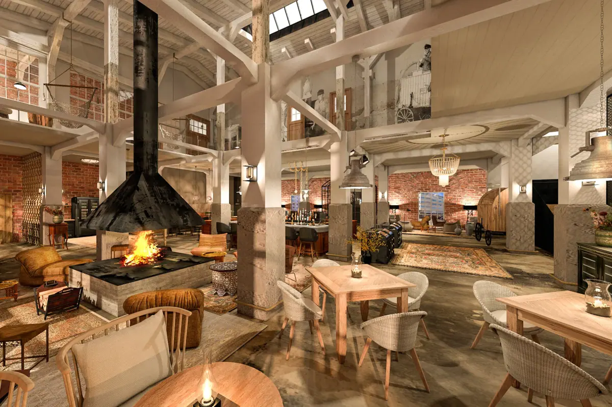 Een open kamer met hoge plafonds, verschillende tafels, stoelen, fauteuils en een open haard.