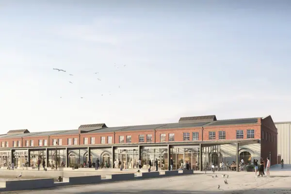 Een gebouw met mensen op de voorgrond.